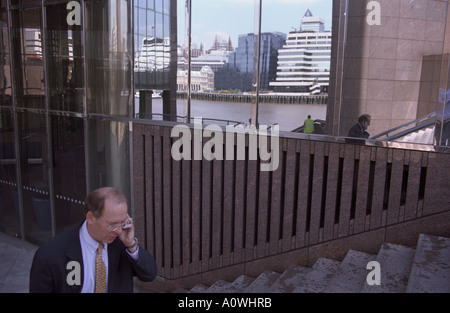 United Kingdom, England, London. Business executive using mobile phone in the City Stock Photo