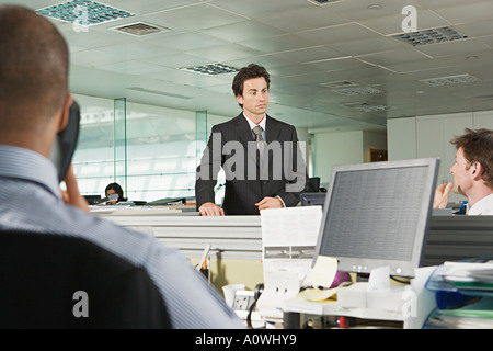 Businessman and office workers Stock Photo