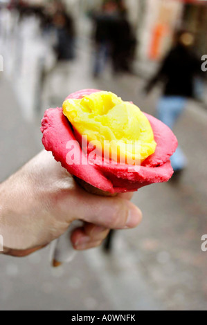 Paris France Male hand Holding Italian Ice Cream from 'Gelati d'Alberto' Store in characteristic form of a rose Frozen sorbet Stock Photo