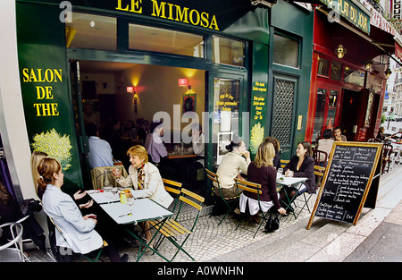 PARIS France, Groups of Women dining Sharing Lunch on Sidewalk Terrace of Local French Bistro Cafe "Le Mimosa" Tea Room (now closed) french woman Stock Photo