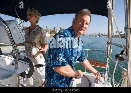 Retired couple sailing their sailboat in California, USA Stock Photo