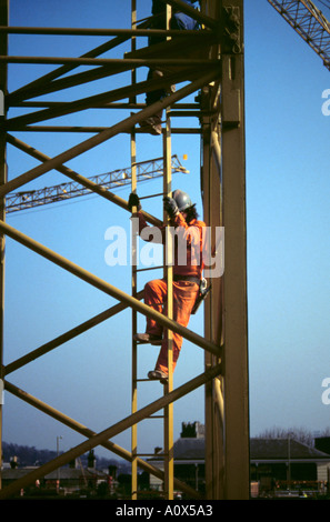 Rigger crane at construction structural steel large residential ...