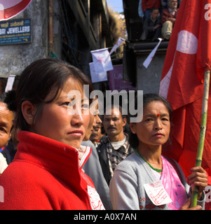 India West Bengal Darjeeling maoist demonstration in the streets of darjeeling portarit of women demonstarting with red flags Stock Photo