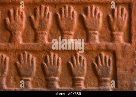 India Rajasthan Jodhpur The Blue City Meherangarh fort Loha gate close up handprints of royal wives on the wall Stock Photo