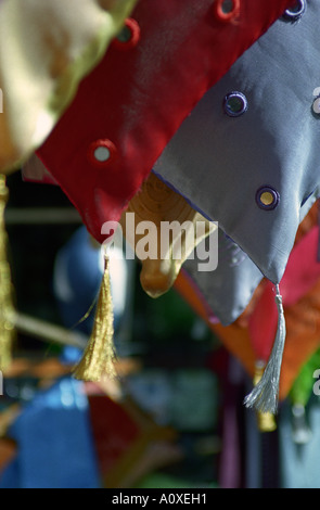 London, UK. Portobello market. Brightly coloured cushions and covers for sale Stock Photo