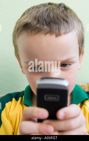 Boy playing with a Nokia mobile phone Stock Photo