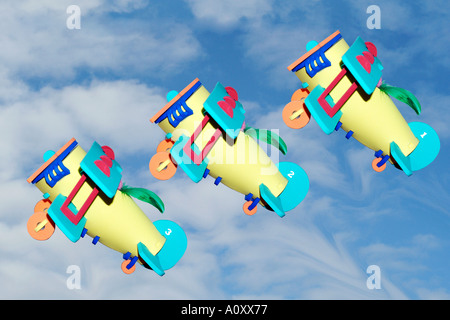 Concept image of 3 toy aeroplanes in the sky. Stock Photo