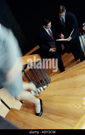 High angle view of two businessmen talking on a staircase Stock Photo