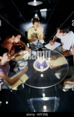 High angle view of five business executives sitting around a conference table Stock Photo