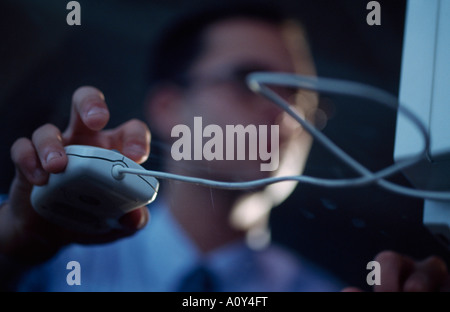 Businessman holding a computer mouse Stock Photo
