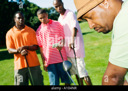 African men playing golf Stock Photo