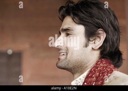 Side profile of a young man smiling Stock Photo