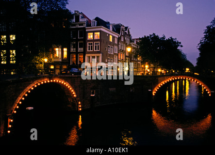 Bridges and row houses along canals at Herengracht and Reguliersgracht Amsterdam Holland Netherlands Europe Stock Photo