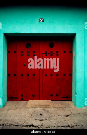 Wooden door painted red Antigua Sacatepequez Department Guatemala Stock Photo