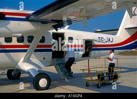 Passengers arriving at Santa Elena International Airport Santa Elena El Peten Department Guatemala Central America Stock Photo