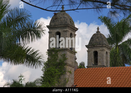 The coral belltowers and the red terracota roof tiles on the Plymouth Congregational Church in Coconut Grove Miami Florida USA Stock Photo