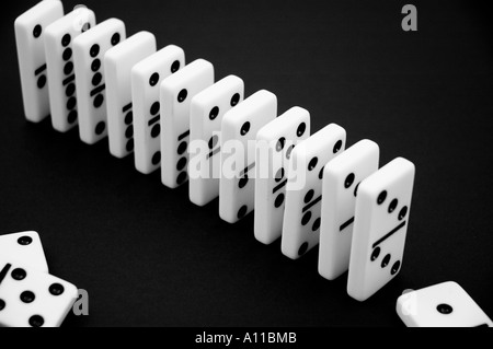 Dominos in a row on a black background closeup close up close-up Stock Photo