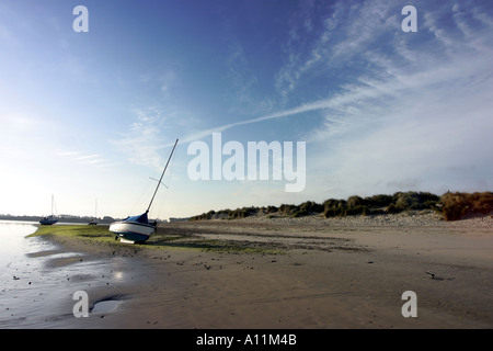 Beached yacht, Easthead beach, Chichester, West Sussex, UK Stock Photo
