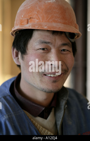 Chinese worker wearing hard hat Stock Photo - Alamy