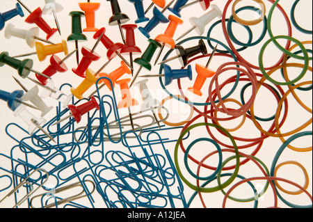 Pins Paper clips and Rubber bands on white background Stock Photo