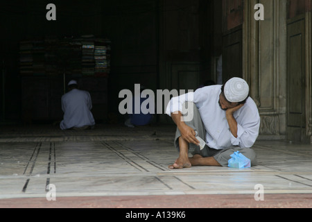 A man sleeping in the mosque, Jama Masjid mosque, Delhi Stock Photo