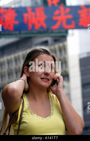 Woman talking on cell phone in Wanchai Hong Kong, SAR Stock Photo