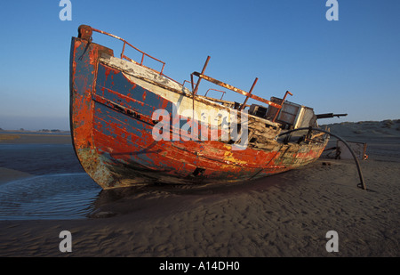 Dumped decaying boat at Braunton Burrows North Devon England Stock Photo