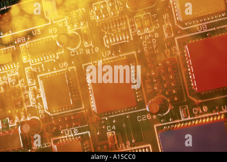 Computer chips and components on computer hard disk circuit board printed circuit and solderd connections Stock Photo