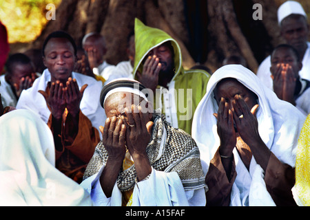 Muslim Fulanis make prayers for the Islamic holiday of Rammadan in the West African country of Guinea Bissau. Guinea Bissau is Stock Photo