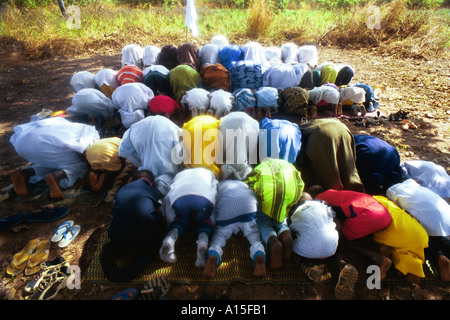 Muslim Fulanis make prayers for the Islamic holiday of Rammadan in the West African country of Guinea Bissau. Guinea Bissau is Stock Photo