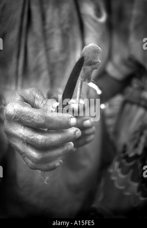 Though the knife is dull alcohol is used to clean Awa Balde after she is circumcisized in the village of Dembel Jumpora in the Stock Photo