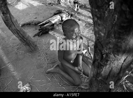 A girl cries after being disciplined in the remote village in Guinea Bissau. Guinea Bissau is ranked as one of the poorest Stock Photo