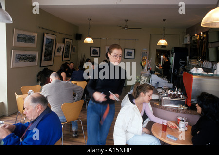 Waitress serving customers at Cafe Brava in the trendy  Pontcanna area of Cardiff Wales UK Stock Photo