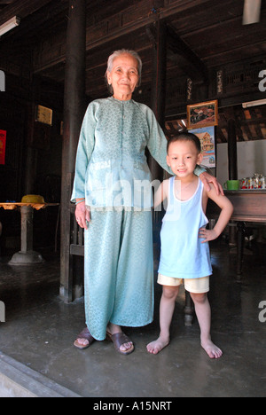 Grandmother and grandson living inside the fortified walls of the city of Hue Stock Photo