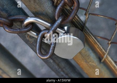 Padlock on chain link fence Stock Photo