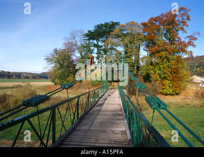 dh  RIVER TWEED BORDERS Suspension footbridge autumnal golden brown trees The Muse temple Stock Photo
