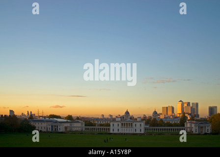 Horizontal wide angle view at sunset across Greenwich Park with the Canary Wharf skyline in the background. Stock Photo