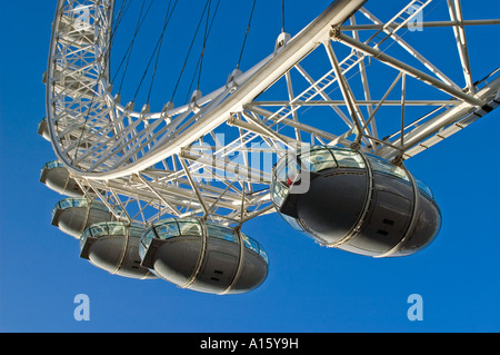 Horizontal close up of the descending capusles on the London Eye, aka Millennium Wheel, against a bright blue sky. Stock Photo