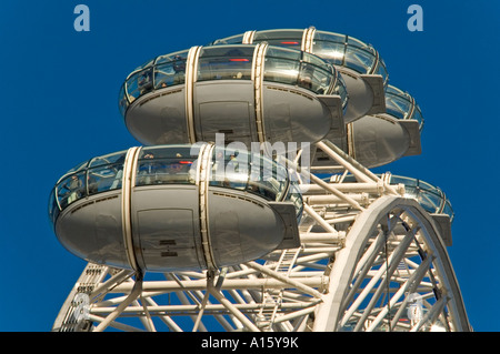 Horizontal close up of the capusles at the top of the London Eye, aka Millennium Wheel, against a bright blue sky. Stock Photo