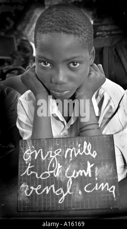 A Senegalese girl who is a refugee from the war in Casamance studies French in makeshift school in Ziguinchor Senegal. Rebels Stock Photo