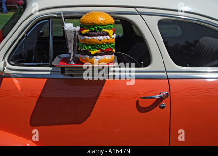 'A 'Plastic ^cheeseburger' and 'drive-in ^window tray' on '^1948 Chevrolet ^Fleetmaster' 2 door'. Stock Photo