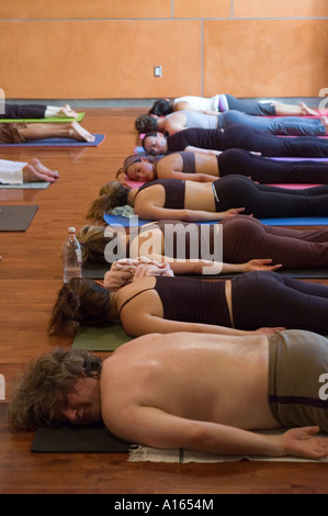 Group practicing yoga indoors Stock Photo