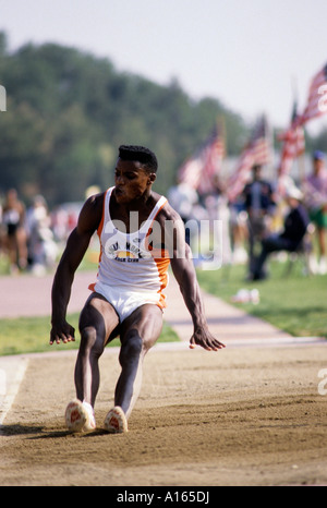 Digital stock image of Carl Lewis competing in track meet Stock Photo