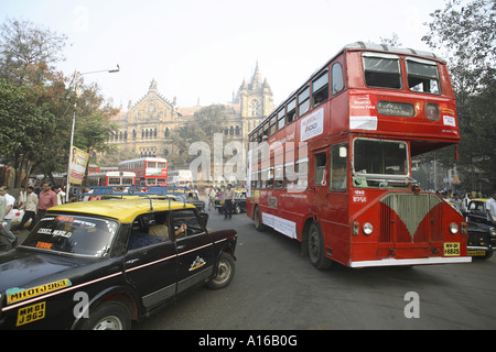 Indian street scene with black yellow top roof taxi with Bollywood ...