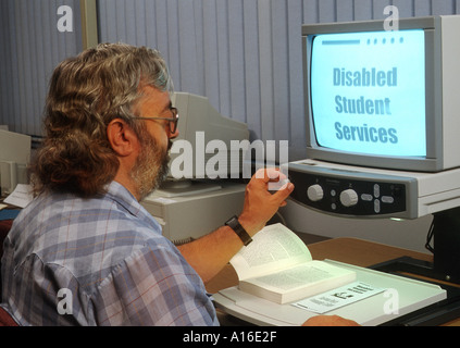 College Disabled student with text enlarger handicap blind Stock Photo