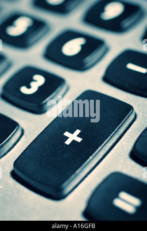Calculator keypad with focus on addition button Stock Photo