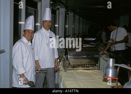 asian chefs of a cruise ship at the midnight buffet banquet Stock Photo