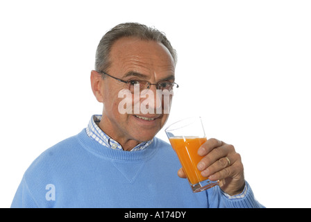 Man drinks orange juice Stock Photo