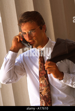 Attractive middle aged businessman talking on cellular phone Stock Photo