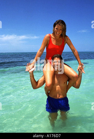Attractive middle aged couple playing in the ocean Stock Photo
